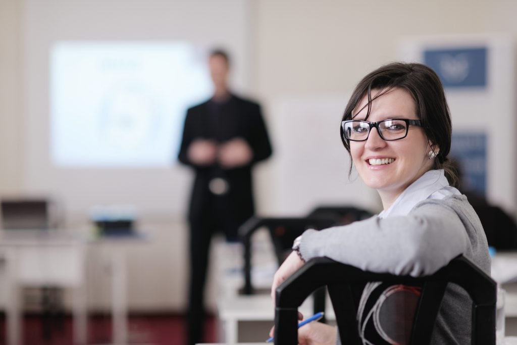 Woman with Glasses Smiling at Camera