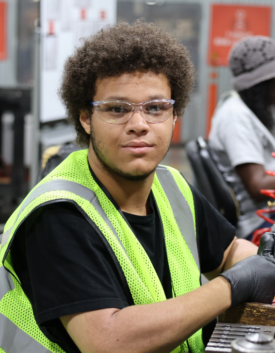 Student technician working with coiled cables