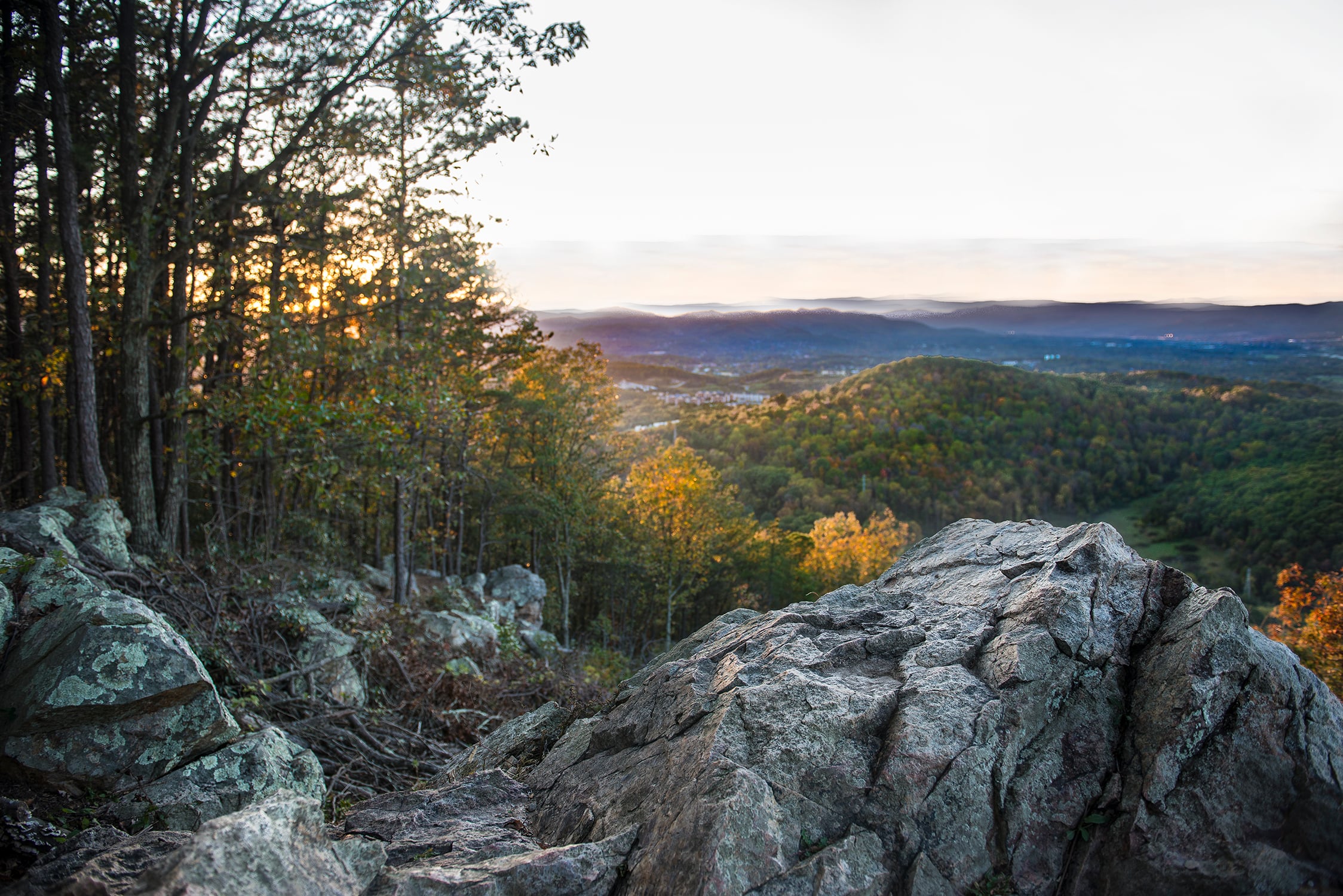 Rocky overlook with forested valley view