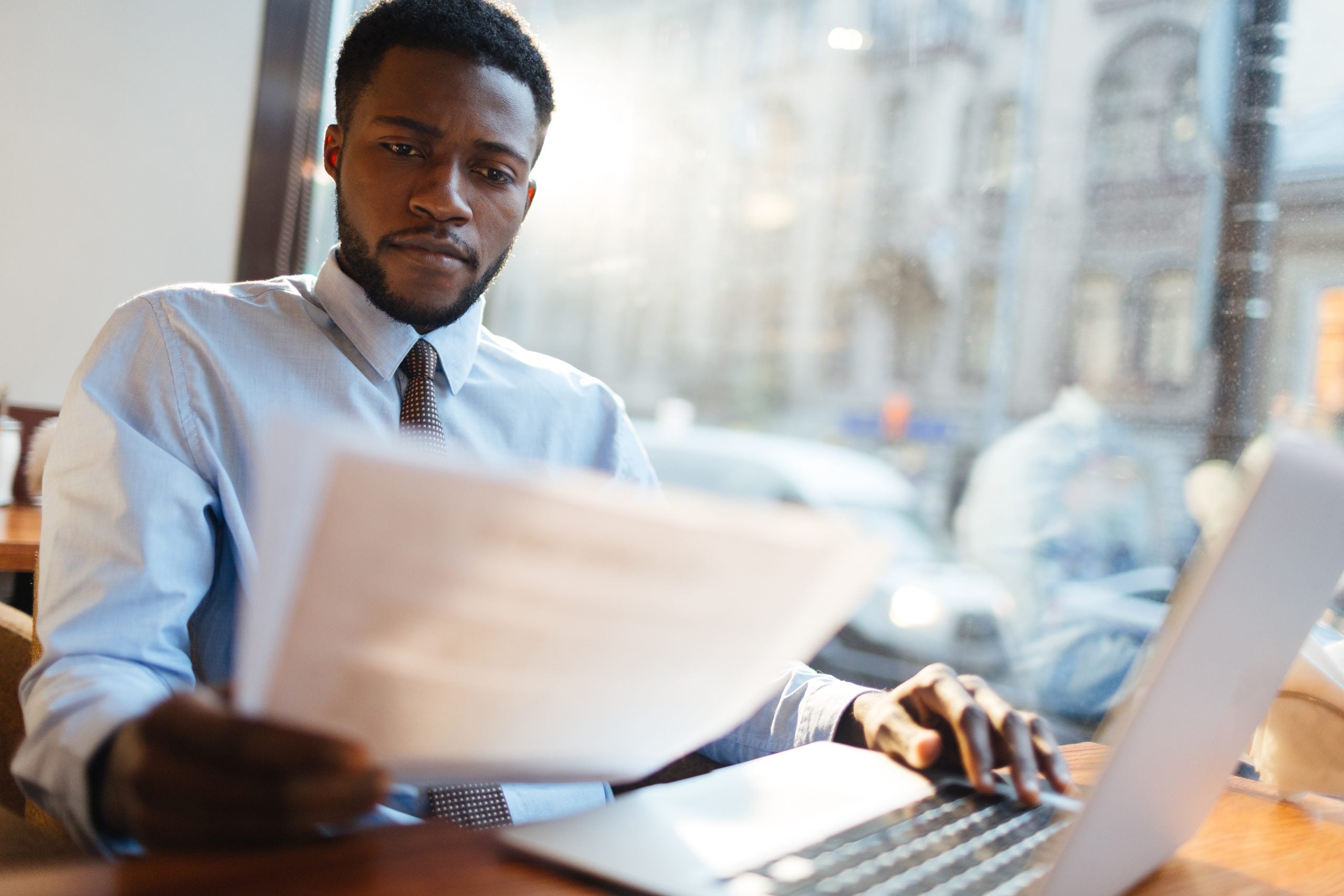 Professional man reviewing paperwork at a desk